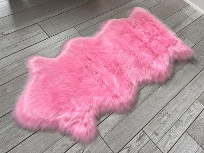 LAMBZY Faux Sheepskin Super Soft Hypoallergenic Free Shape Silky Shag Rug, Luxury Shaggy Plush Carpet for Bedrooms Living Kids Room Sofa Rugs (Pink, Single and a Half 2'x4')